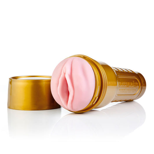 Masturbador masculino Fleshlight Pink Lady con abertura vaginal realista en silicona rosa, carcasa rígida dorada y textura interna diseñada para simular la sensación vaginal
